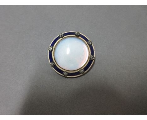 A late 18th century enamel, diamond and glass memorial pendant, of circular form and closed back setting, with a central tran