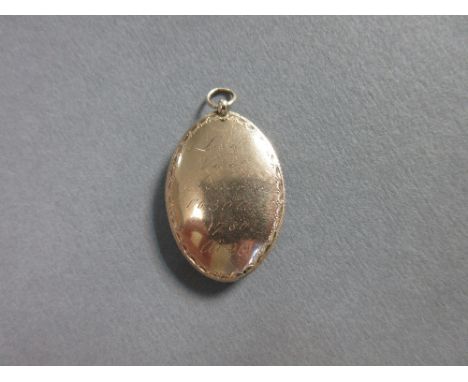 A Georgian memorial pendant for Viscount Ashbrook, the marquise shaped pendant with bright cut decorative edge engraved on on