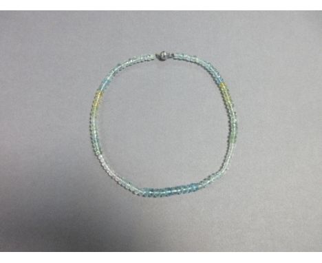 A faceted bead necklace of aquamarines and other precious beryls, the faceted bouton beads of 4.5-6.5mm diameter of various c