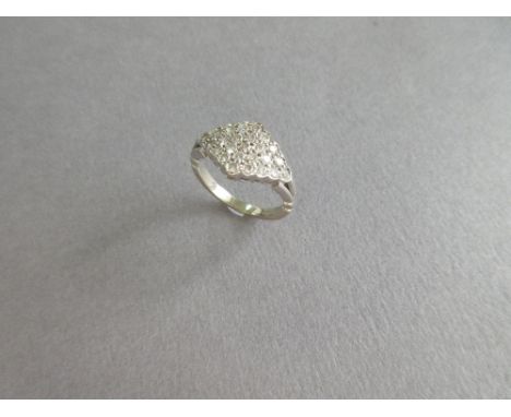 An 18ct gold and diamond plaque ring, the lozenge shape plaque pavé set with round brilliant cut diamonds to trifurcated shou