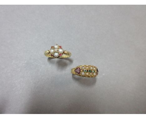 Two seed pearl and gemset rings, the first with a quatrefoil of natural 3mm half pearls and four small garnet points around a