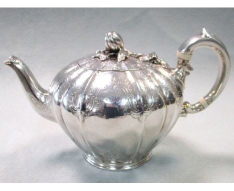 A Victorian silver teapot, by Samuel Smiley (Goldsmiths Alliance), London 1865, of shouldered globular form, the cover with m