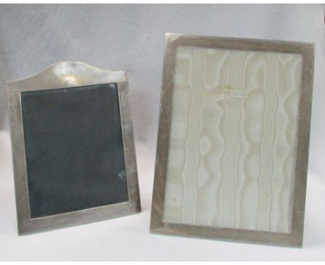 A George V silver easel photograph frame, Birmingham 1926 with arched 'sunburst' cresting, 33.5 x 25.5cm (13 x 10in ); a larg