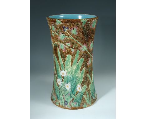 A George Jones Majolica umbrella stand, naturalistically moulded as a tree trunk with daisies, ferns and blackberry briars, t