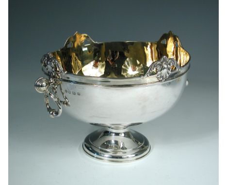 A George V silver two handled punch bowl, by William Hutton & Sons, Sheffield 1929, the plain body with moulded girdle and fo
