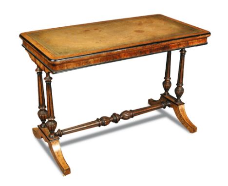 An amboyna wood and walnut writing table in the manner of Holland & Son - late 19th century, with a leather lined top, on twi