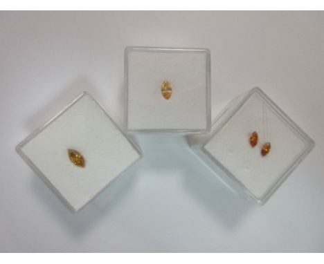Four fancy coloured loose marquise cut diamonds, the first of deep saturated greenish golden yellow, estimated weight 0.45cts