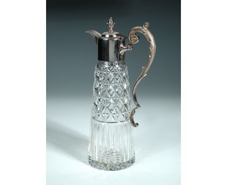 A silver mounted claret jug, by Sterling Silverware Ltd, Sheffield 1976, with plain collar and acanthus cast spout, the domed