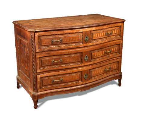 A South German walnut commode - late 18th century, of serpentine outline, decorated in the neo-classical manner with parquetr