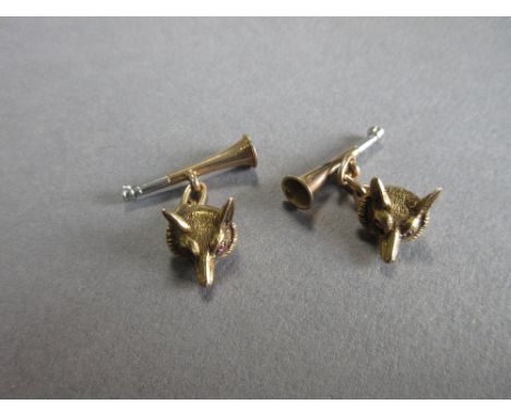 A pair of vintage fox mask and hunting horn cuff links, each with a realistically modelled fox mask at one end, with pink har