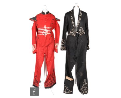 A 1930s parade costume for a musician, the cotton jacket in red with black mandarin collar with cord piping and epaulets, the