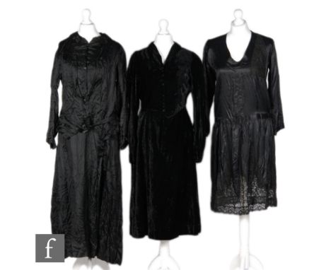 Three 1930s ladies vintage black dresses, the first in velvet with a waistcoat type bodice fastening with poppers beneath a p