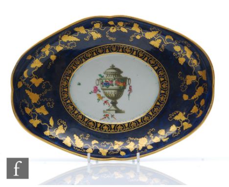 A late 18th Century Worcester oval shaped dish decorated to the central well with a hand painted lidded urn with garlands of 