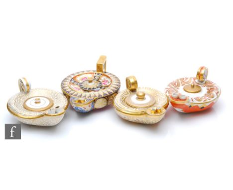 Four 19th Century oil lamps modelled on Roman oil lamps each with gilt and enamel decoration, all unmarked, largest length 15