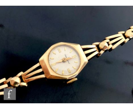 A 9ct hallmarked Smiths Imperial manual wind wrist watch, batons to a circular dial and integral three bar gate link bracelet