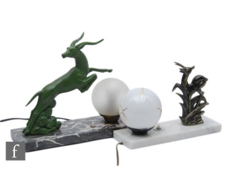 A 20th Century Art Deco table lamp, decorated with a green painted spelter stylised leaping gazelle with a frosted sphere sha