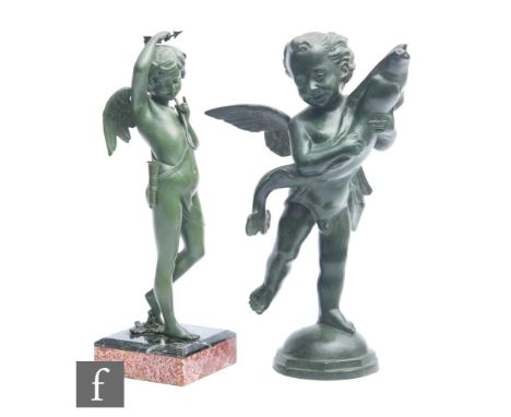 A 20th Century green bronzed spelter study of a winged amorini holding a fish, standing on a dome base, height 39cm, together