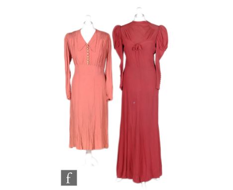 A 1930s ladies vintage evening dress in deep red chiffon, with high neck and bow decoration to the bodice, leg of mutton slee