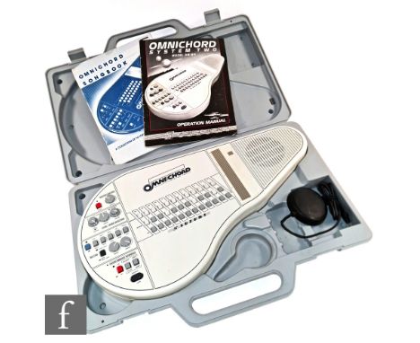A Suzuki Omnichord system two model OM-84, sold in original case with foot switch, operation manual and songbook. 