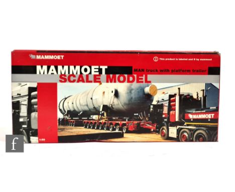 A Conrad 61132/0 1:50 scale Mammoet MAN 4-axle truck with 10-axle platform trailer, boxed. 