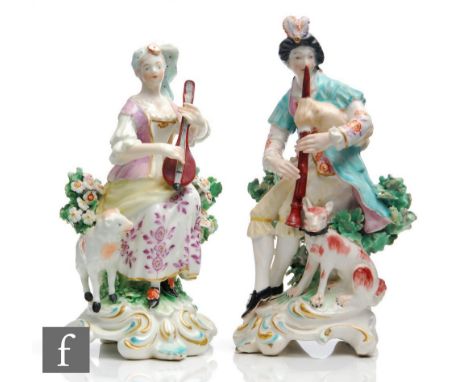 A pair of 19th Century Derby figures of musicians,&nbsp;she modelled playing the lute with a lamb to her side, he modelled pl