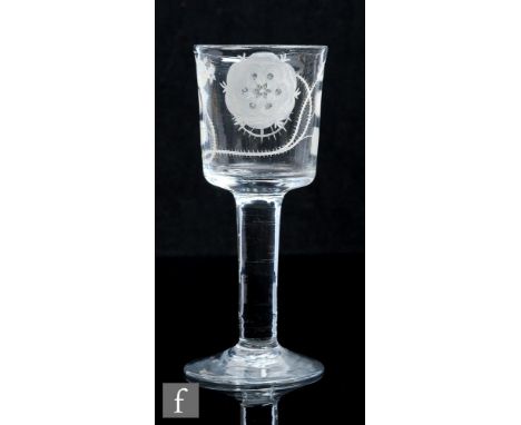 An 18th Century Jacobite drinking glass, circa 1745, the bucket form bowl engraved with a six petalled rose and two buds on a