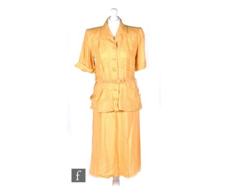 A late 1940s ladies vintage two piece safari suit in mustard yellow, the short sleeved belted jacket with button fastening, t