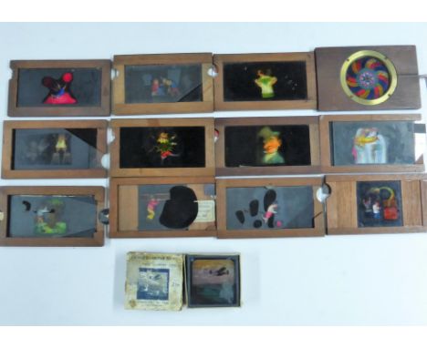 MAHOGANY FRAMED MAGIC LANTERN SLIDES INC. 1 MECHANICAL KALEIDOSCOPE SLIDE AND 'SLIP SLIDER' SLIDES (11), ONE LABELLED JOHN PI