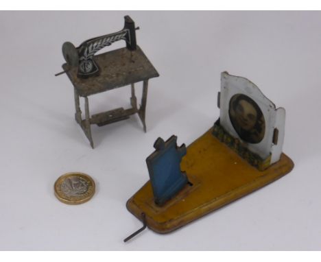 TIN PLATE TOYS, A TREADLE SEWING MACHINE AND A PROJECTOR AND SCREEN