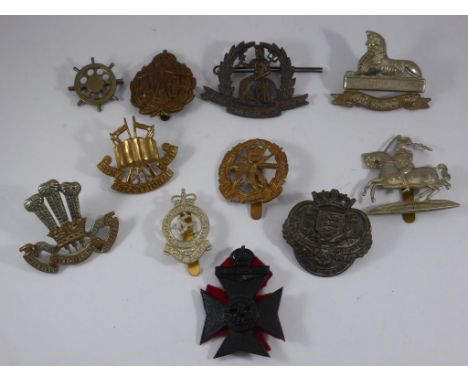 PART OF A LARGE COLLECTION OF MILITARY CAP BADGES, INC. LOUTH SCHOOL AND GRESHAMS SCHOLL OTC, SMALL ARMS SCHOOL, ARMY EDUCATI