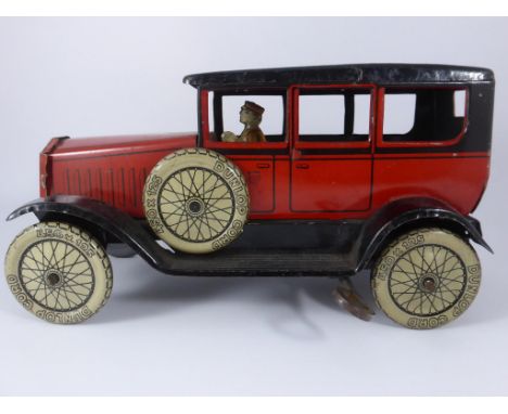 GERMAN CLOCKWORK TIN PLATE LIMOUSINE, RED LIVERY, SIMULATED DUNLOP CORD TYRES, NUMBER 4618