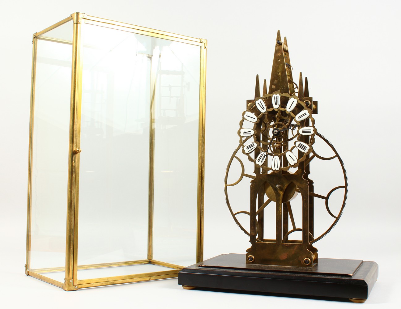 A GOOD MODERN, LARGE SKELETON CLOCK, in a glass case. 1ft 9ins high