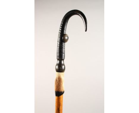 AN ALPINE WALKING STICK, with hoof handle. 39ins long.