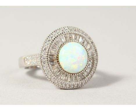 A GILSON OPAL AND CZ ROUND SET RING.