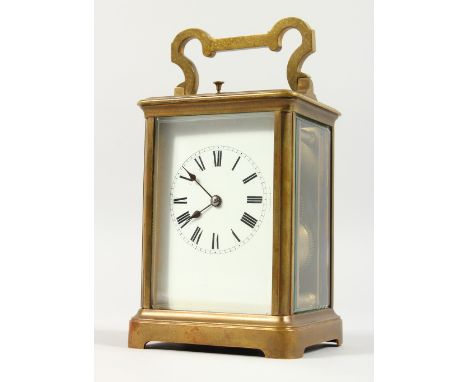 A GOOD FRENCH BRASS CARRIAGE CLOCK, with repeat movement, white enamel dial and Roman numerals. 5.5ins high.