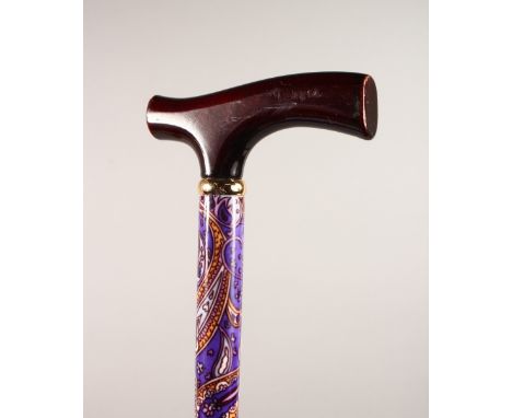 A LADIES COLOURFUL WALKING STICK. 35ins long.