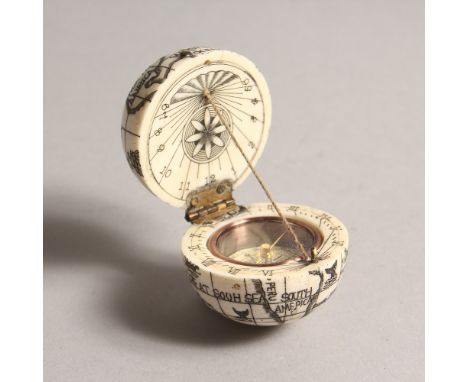 A BONE FOLDING GLOBE/COMPASS. 1.75ins diameter.