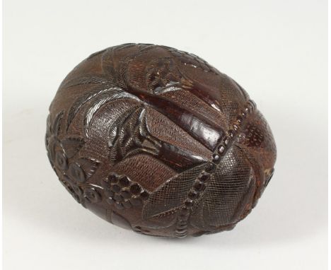 A CARVED NUT "BUG BEAR" FLASK. 5ins.