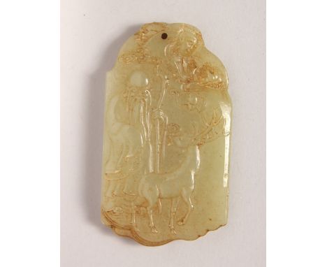 A CARVED JADE PENDANT. 2.75ins high.