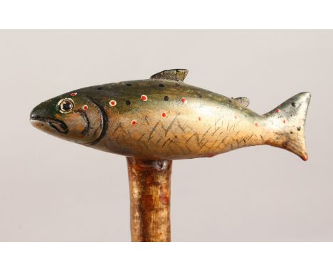 A WALKING STICK with carved and painted salmon handle. 50ins long.