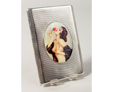 AN ENGINE TURNED SILVER CIGARETTE CASE, with oval nude smelling a rose. Birmingham 1954.