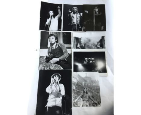 GENESIS - 8 original b/w vintage prints of Genesis (during the Peter Gabriel period), allwith photographers stamps on verso. 