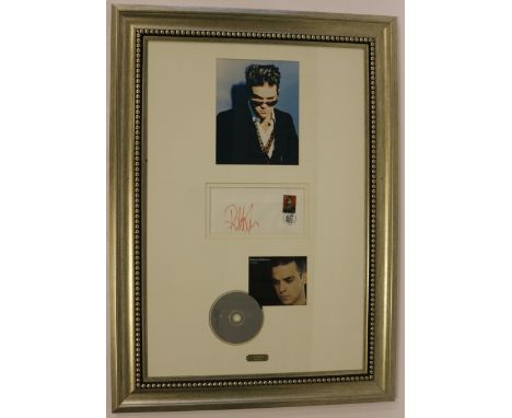 ROBBIE WILLIAMS - a Robbie Williams display featuring a signed first day cover (Blackpool 2001), an 8x10" colour photograph a