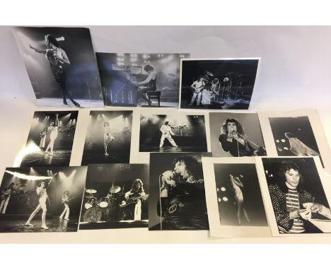QUEEN - 13 original b/w vintage prints of Queen (Freddie Mercury, Brian May, Roger Taylor and John Deacon), many with photogr