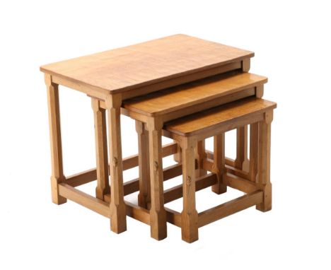 Mouseman: A Robert Thompson English Oak Nest-of-Tables, on four octagonal legs, each with carved mouse signature, largest 61c