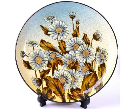 Christopher Dresser (Scottish, 1834-1904) for Linthorpe Pottery: A Charger, painted by Fred Brown, with daisies, impressed HT