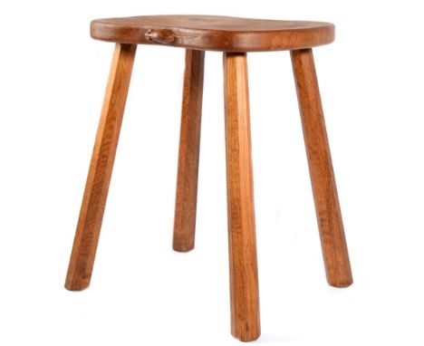 Mouseman: A Robert Thompson English Oak Cow Stool, shaped seat on four octagonal legs, with carved mouse signature, 45.5cm