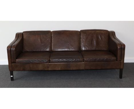 A 1970s Danish Design Three-Seater Brown Leather Sofa, in the manner of Borge Mogensen, with eight cushions and plain seat ra