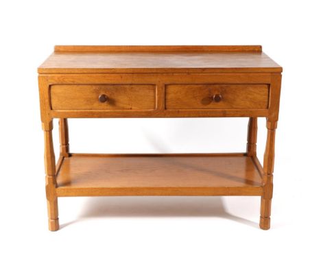 Squirrelman: A Wilfrid Hutchinson (Husthwaite) English Oak Serving Table, with raised upstand, the rectangular top above two 