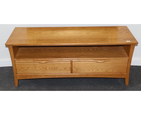 An Ercol Light Ash Television Unit, modern, the base with two drawers, 132cm by 44cm